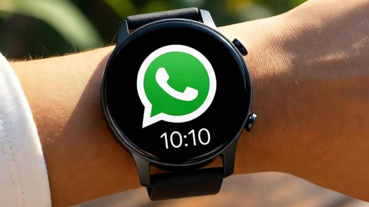 Fire-Boltt Dream Android Smartwatch placed on a clean white desk beside a smartphone and coffee mug, showing its large display with colorful app icons and a sleek rectangular design.